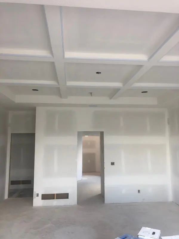 Coffered ceiling and walls in fresh drywall, taped and sanded